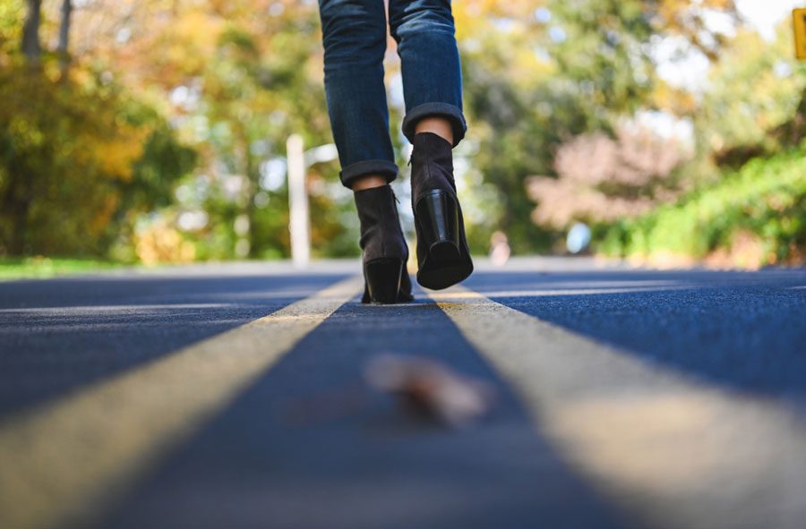 view-from-the-ground-of-someone-crossing-the-street